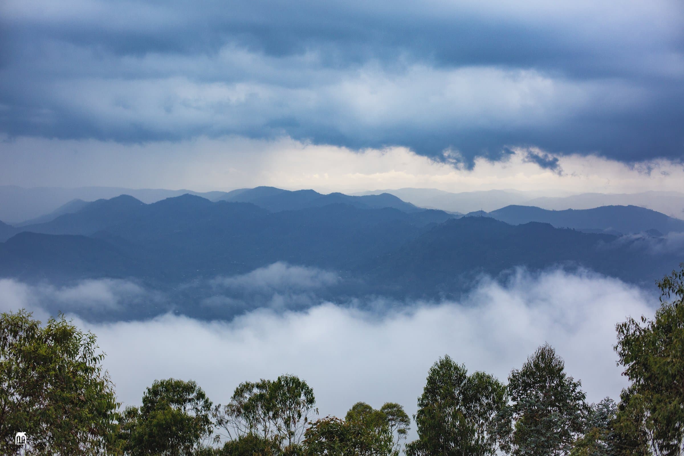 Mist filling the valleys below the Mount Kabuye trail