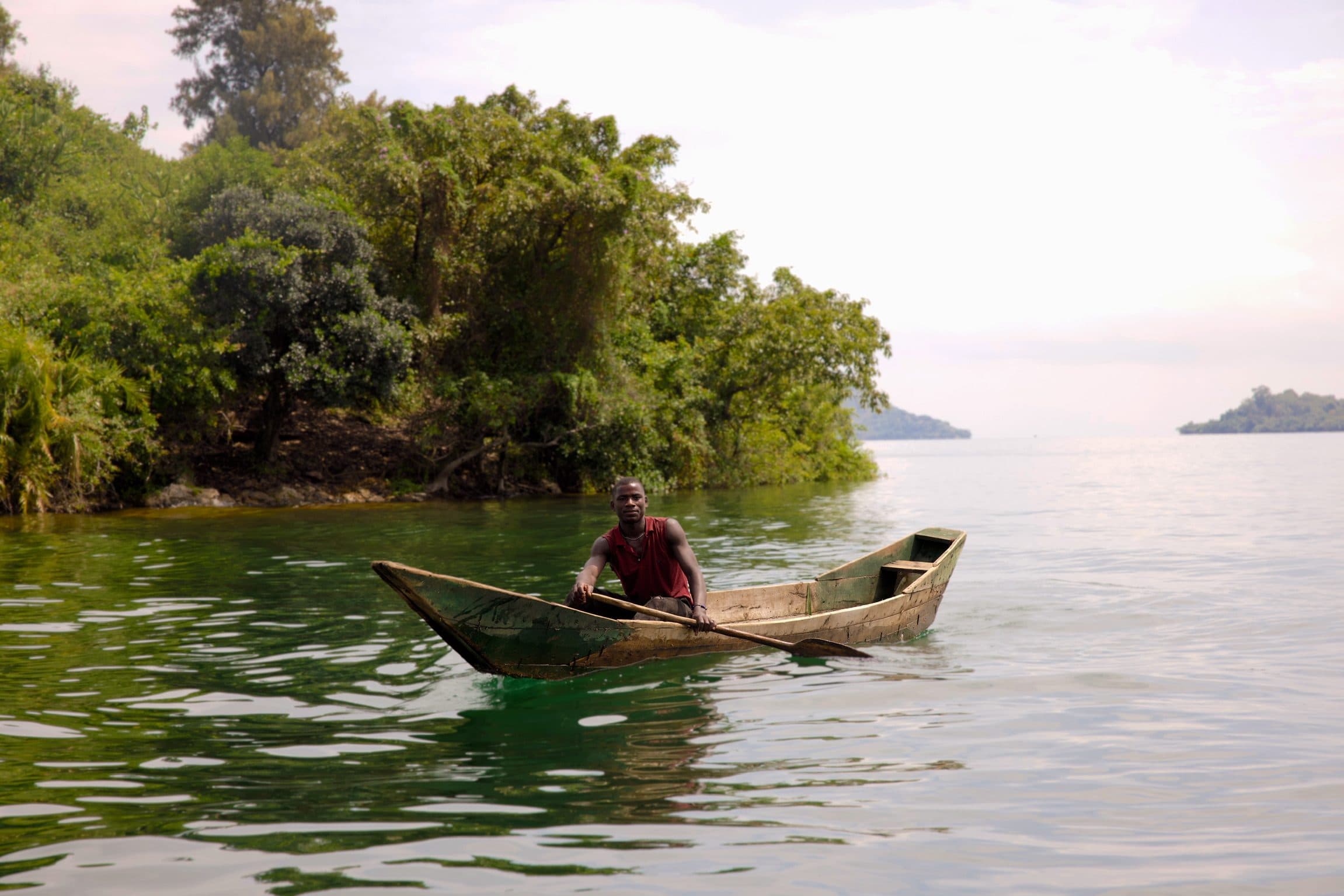 Fisherman paddling a canoe on Lake Kivu